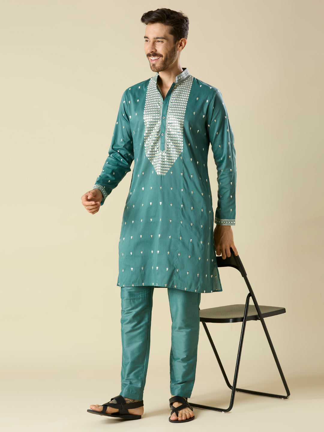 BOTTLE GREEN KURTA PYJAMA SET WITH INTRICATE EMBROIDERY AROUND NECKLINE
