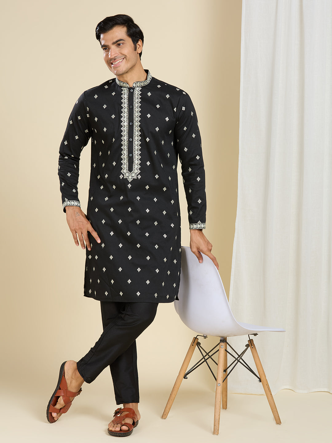 BRILLIANT BLACK KURTA PYJAMA SET WITH INTRICATE EMBROIDERY AROUND NECKLINE