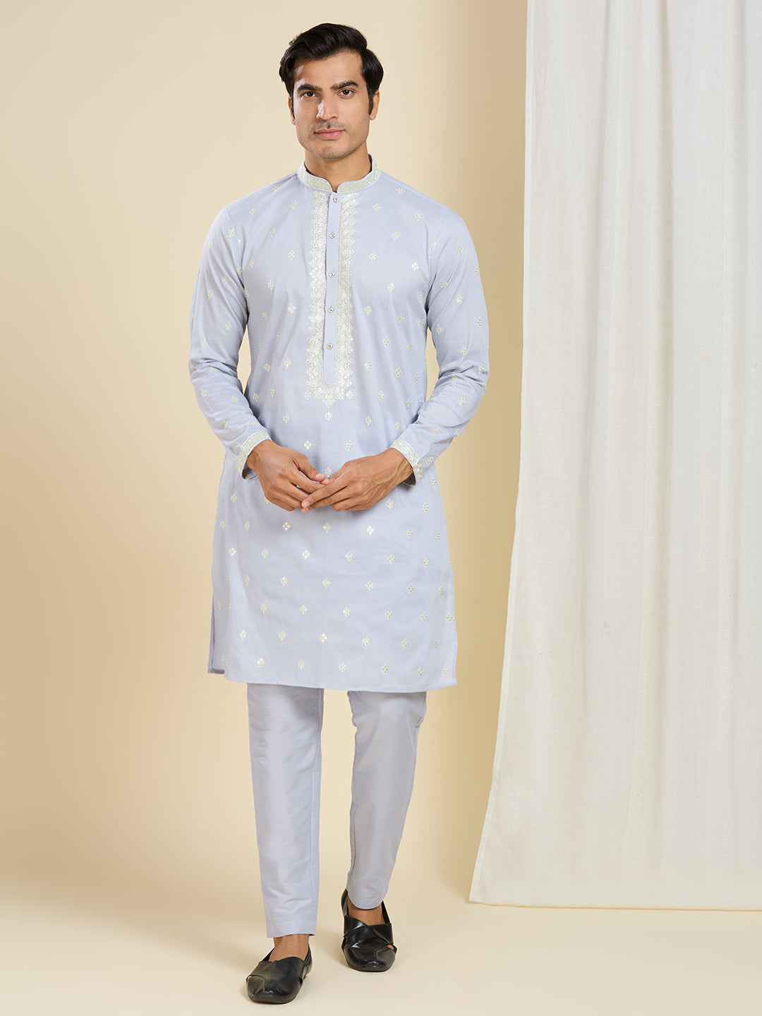 LIGHT BLUE KURTA PYJAMA SET WITH INTRICATE EMBROIDERY AROUND NECKLINE