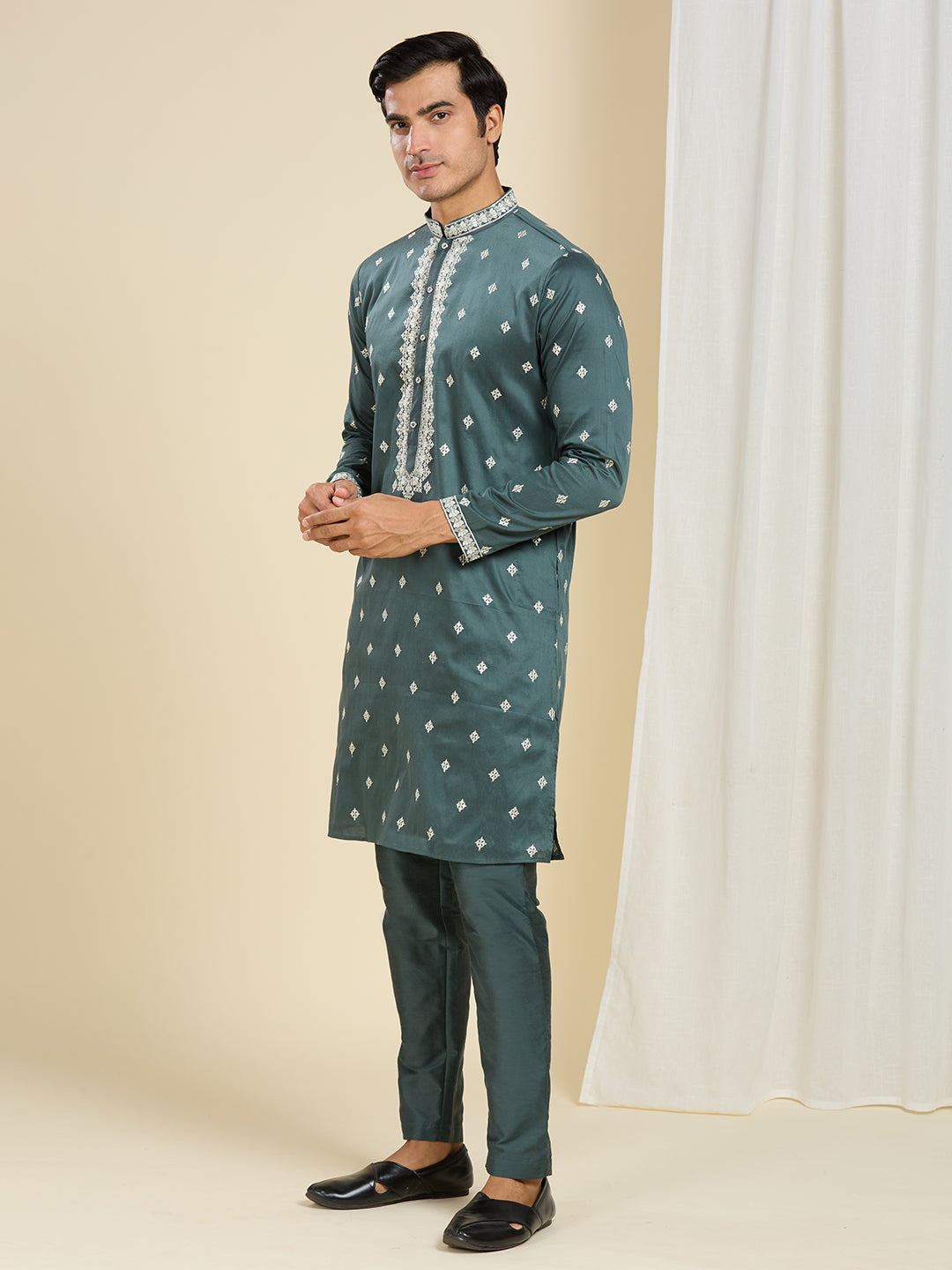 BOTTLE GREEN KURTA PYJAMA SET WITH INTRICATE EMBROIDERY AROUND NECKLINE