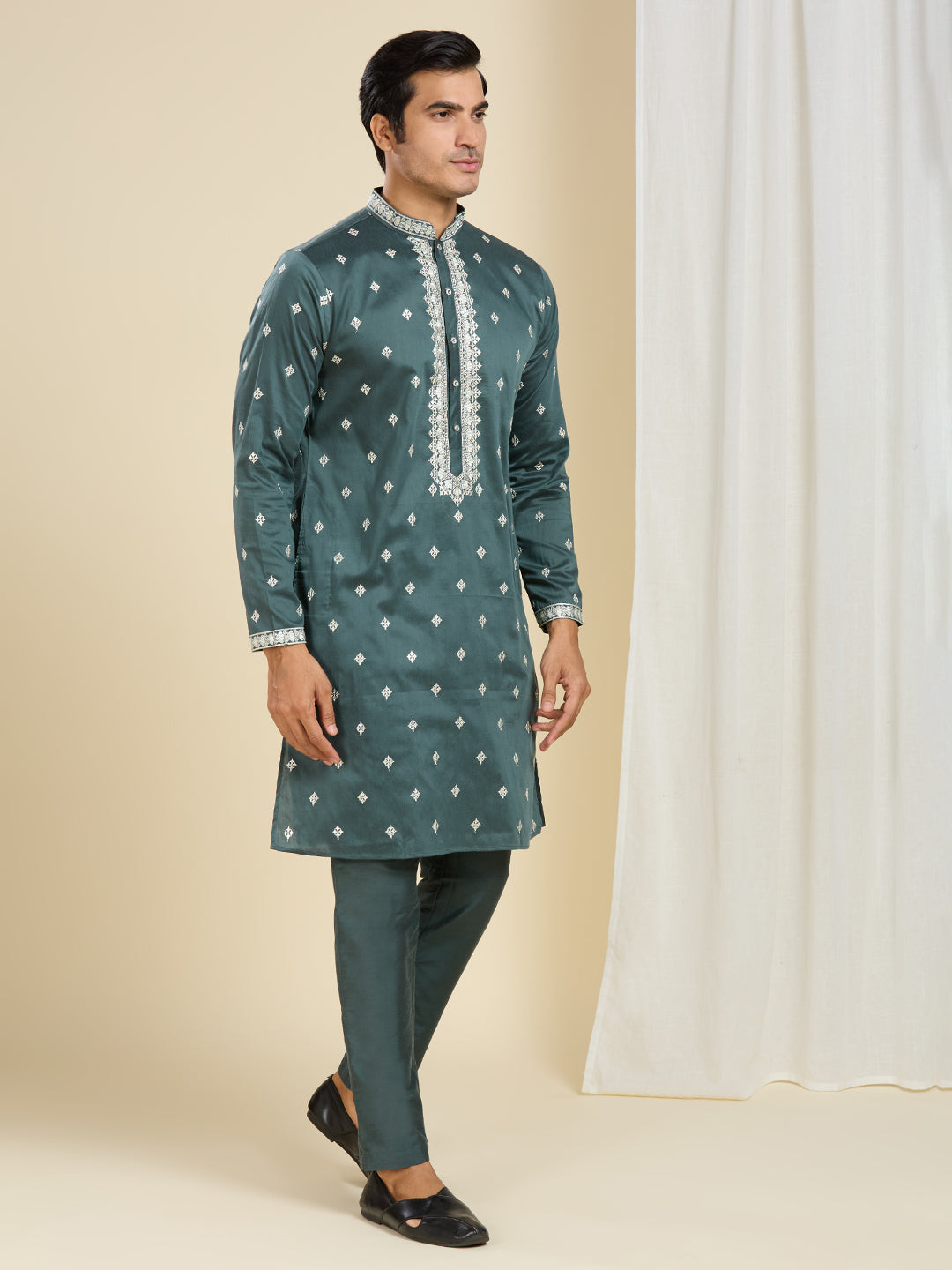 BOTTLE GREEN KURTA PYJAMA SET WITH INTRICATE EMBROIDERY AROUND NECKLINE