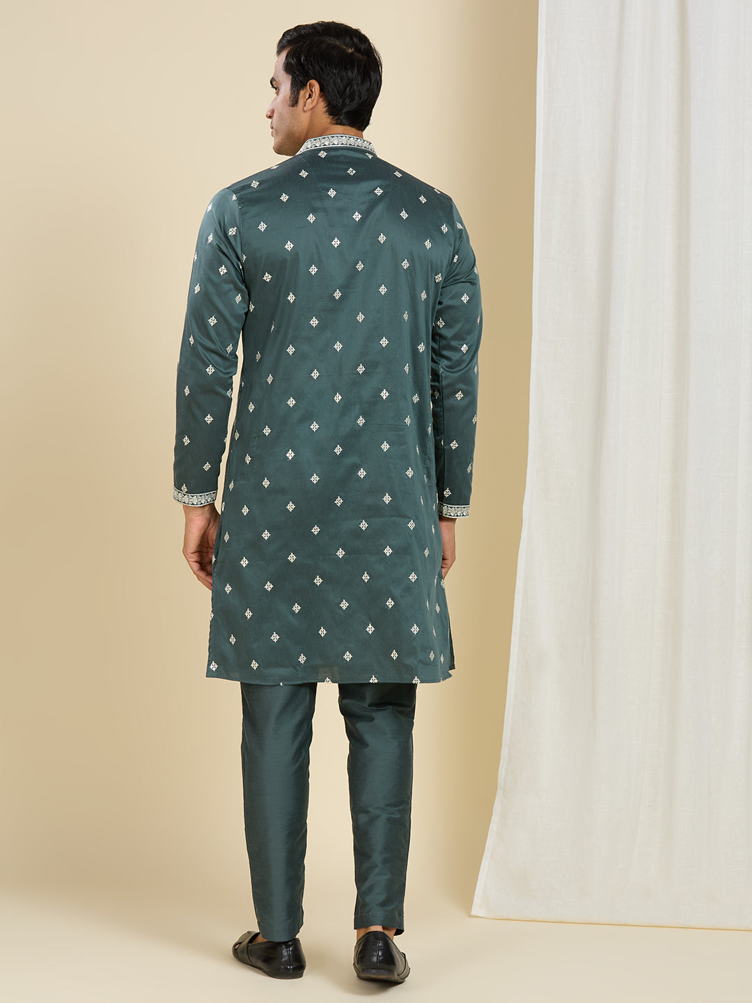BOTTLE GREEN KURTA PYJAMA SET WITH INTRICATE EMBROIDERY AROUND NECKLINE