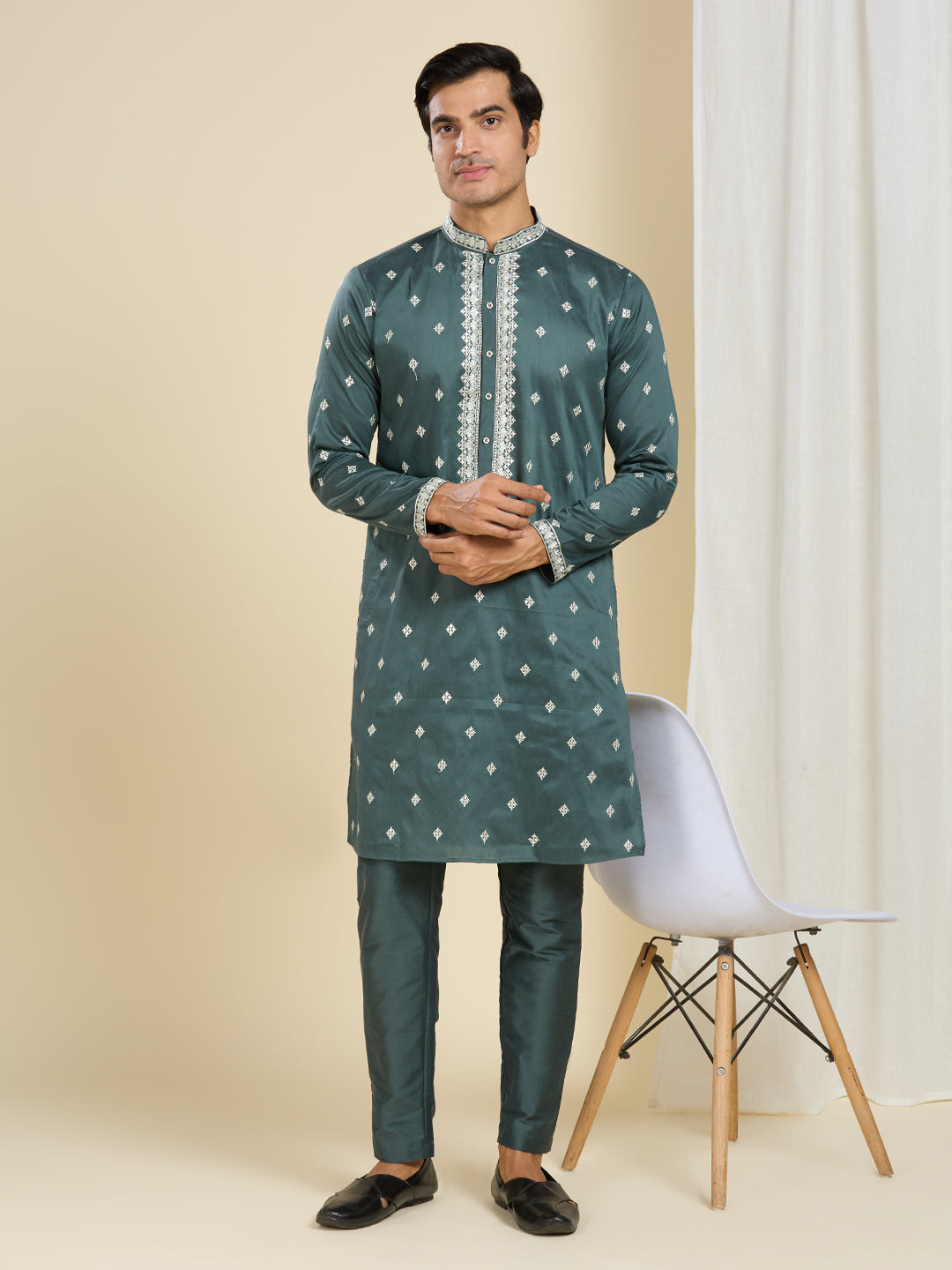 BOTTLE GREEN KURTA PYJAMA SET WITH INTRICATE EMBROIDERY AROUND NECKLINE