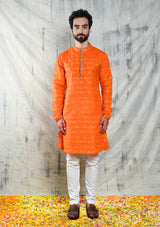 ORANGE RAW SILK KURTA PYJAMA SET WITH CONTRAST PIPING DETAIL
