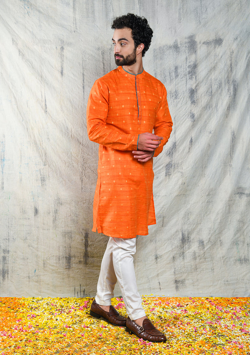 ORANGE RAW SILK KURTA PYJAMA SET WITH CONTRAST PIPING DETAIL
